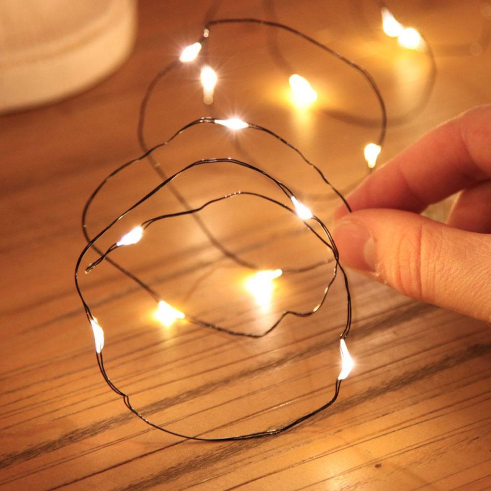 Micro Battery Fairy Lights on Black Wire, 20 Warm White LEDs : close up of string