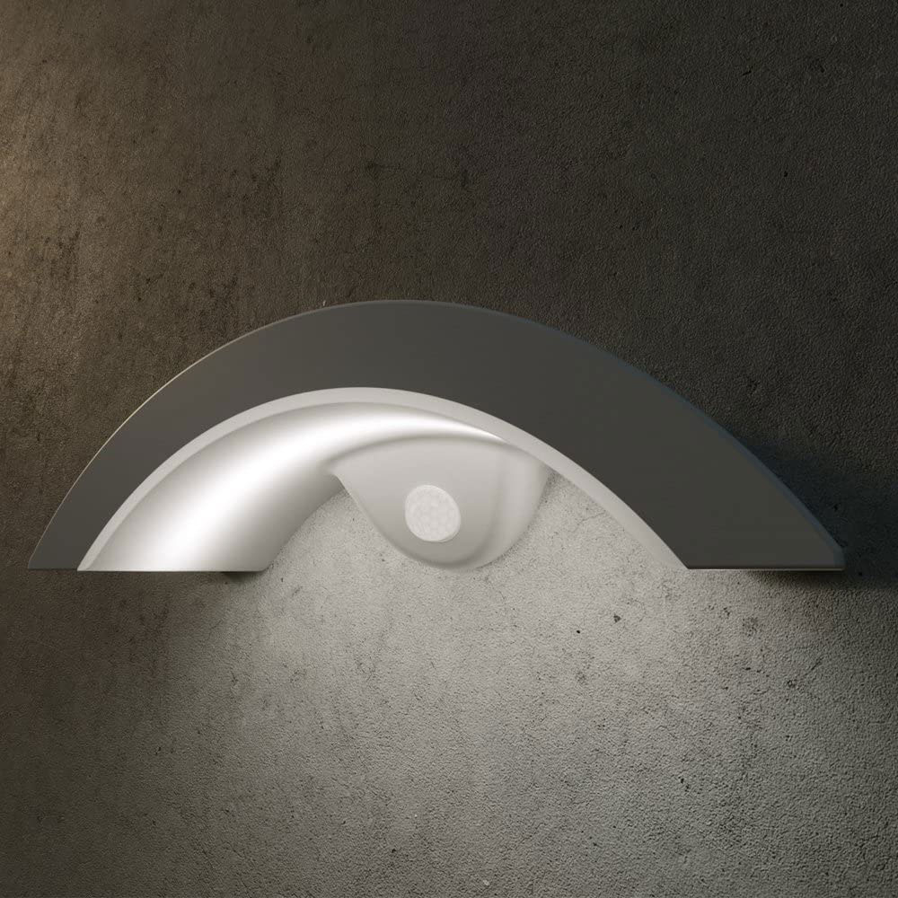 Arch Solar Wall Sensor Light mounted on a wall at night