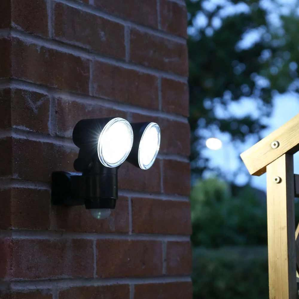 Battery Motion Sensor Light Outdoor mounted near front door of house at night