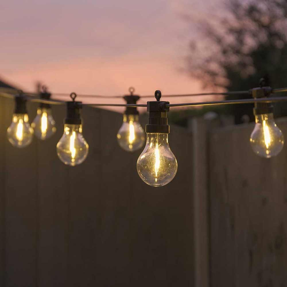 Battery Operated Filament Festoons outside at night in garden