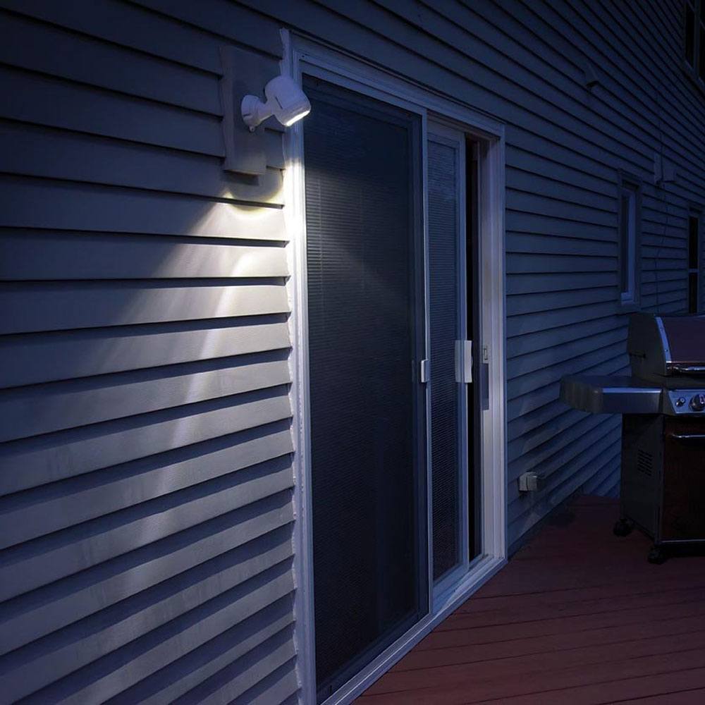 Battery Spotlights in white in action outside patio area