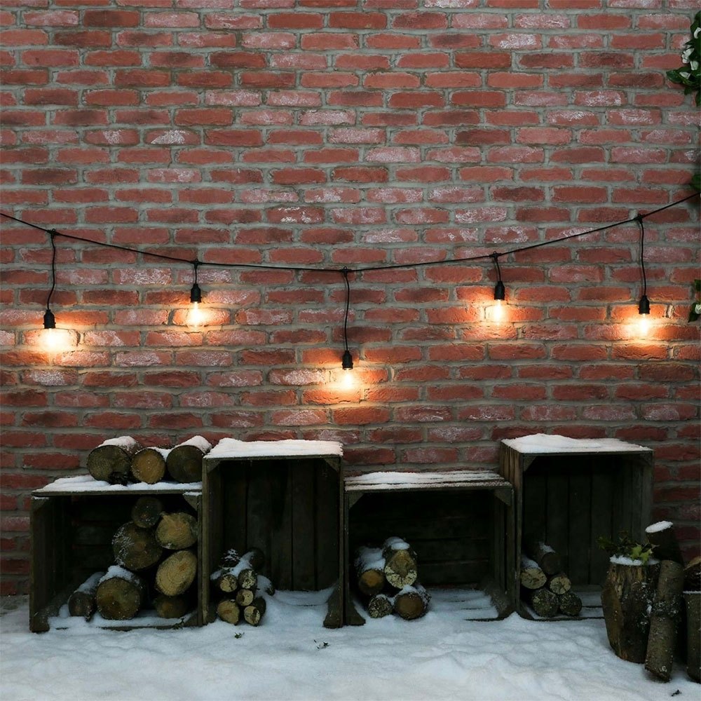 Bistro Festoon Lights with Filament Bulbs hanging on wall