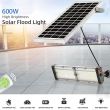 40W Premium Solar Floodlight with ALS Technology – 6000 Lumens showing the lights being used on a modern building with the remote control 