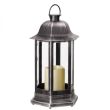 Nordic Candle Lanterns in garden flower bed