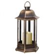 Nordic Candle Lanterns in garden flower bed