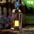 Nordic Candle Lanterns in garden flower bed