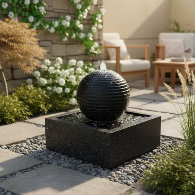 Black Granite Solar Water Feature – polished black granite-effect column with water flow and LED in garden