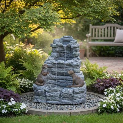 Otter Falls Solar Cascade – stone-effect multi-drop cascade with otter sculptures in garden