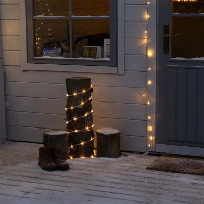 Connectable Rope Lights on log outside