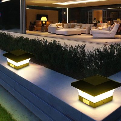 Fence Post Solar Light Caps - 2 Pack installed on a low lying wall in a patio area