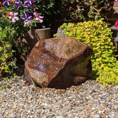 Glacier Stone Solar Water Feature – genuine pale glacier stone with water flowing from top in garden