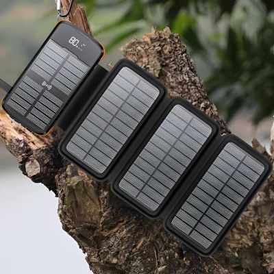 Professional Solar mobile Charger Charging in the sun hung from a carabina 