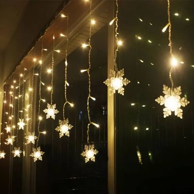 Solar Christmas Snowflake Lights – LED Outdoor String with Remote Hanging on a customers window outside their house