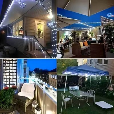 50 LED Solar Firefly String Lights Showing the white LED version around the garden on handrails and wires