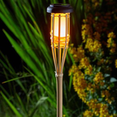 Bamboo Flaming Torch in garden at night