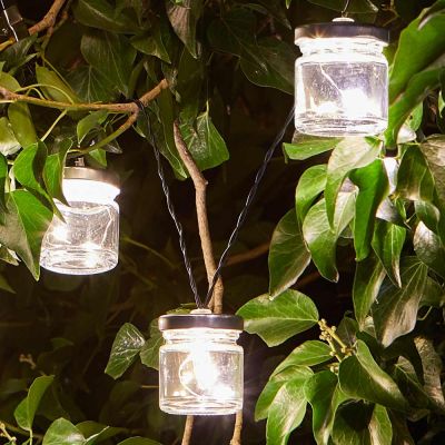 Firefly Jar Solar String Lights close up of jars in tree at night