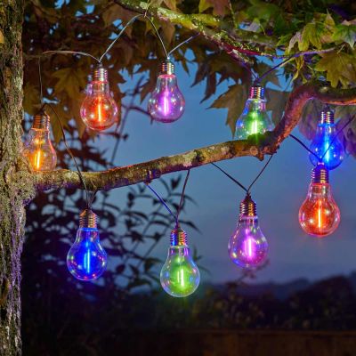 Solar Eureka Neon-Esque Lightbulbs in tree in garden at night