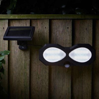 Solar Motion Sensor Light Outdoor PIR mounted on fence