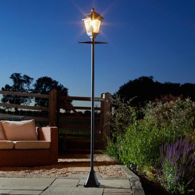 Victoriana 365 Solar Powered Lamp Post in garden at night turned on