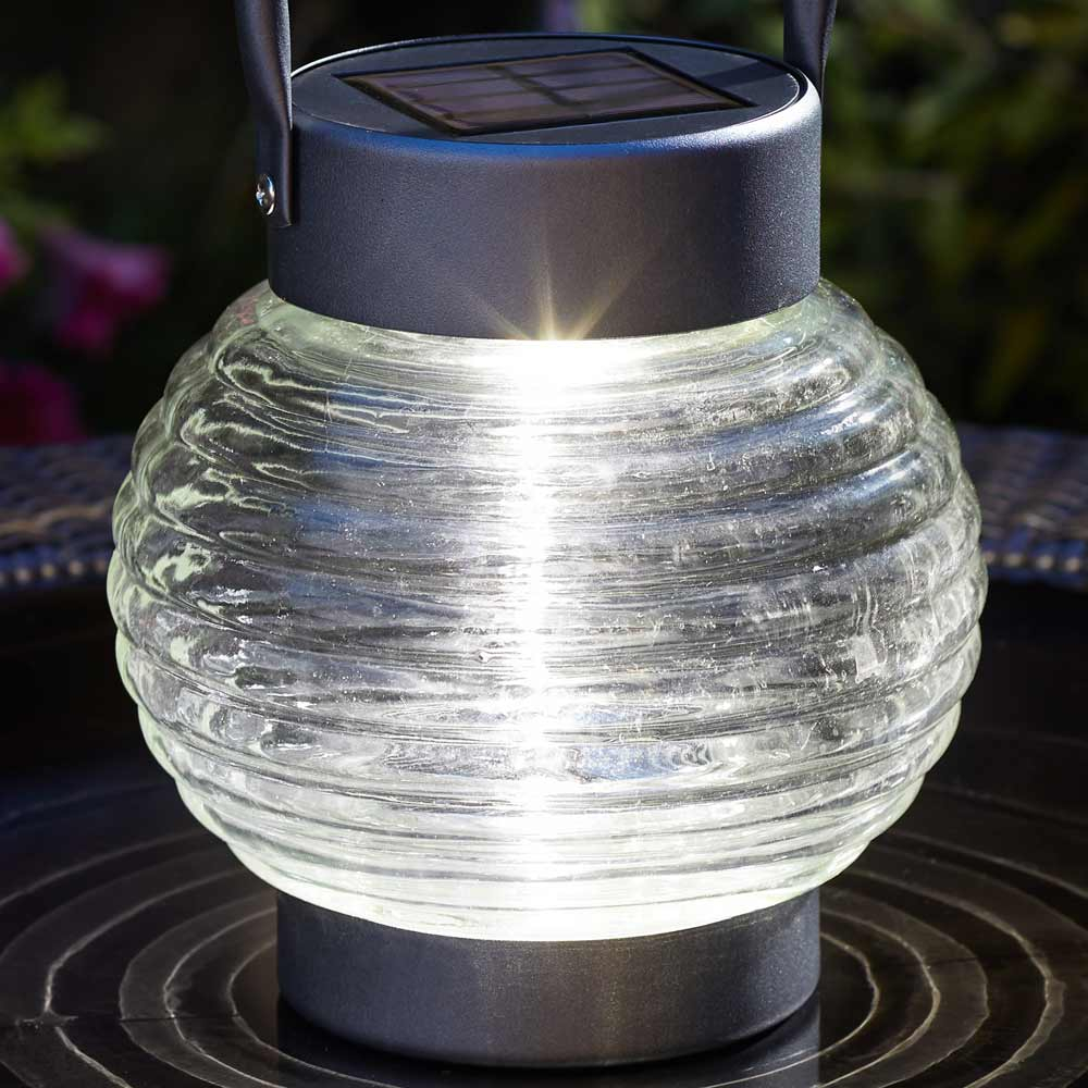 Globe 365 Solar Powered Lantern on table close up of galss