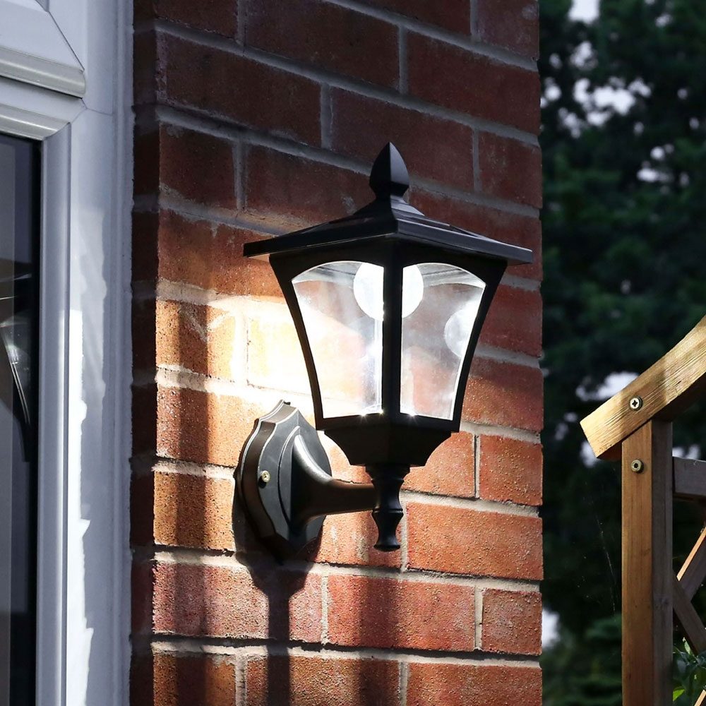 Outdoor Solar Wall Light, White installed on wall outside front door
