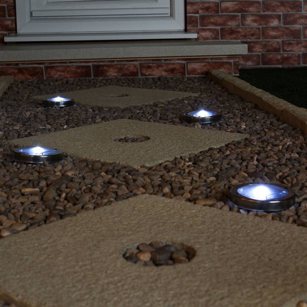 Solar Decking Lights Stainless Steel - Pack of 4 installed on a driveway