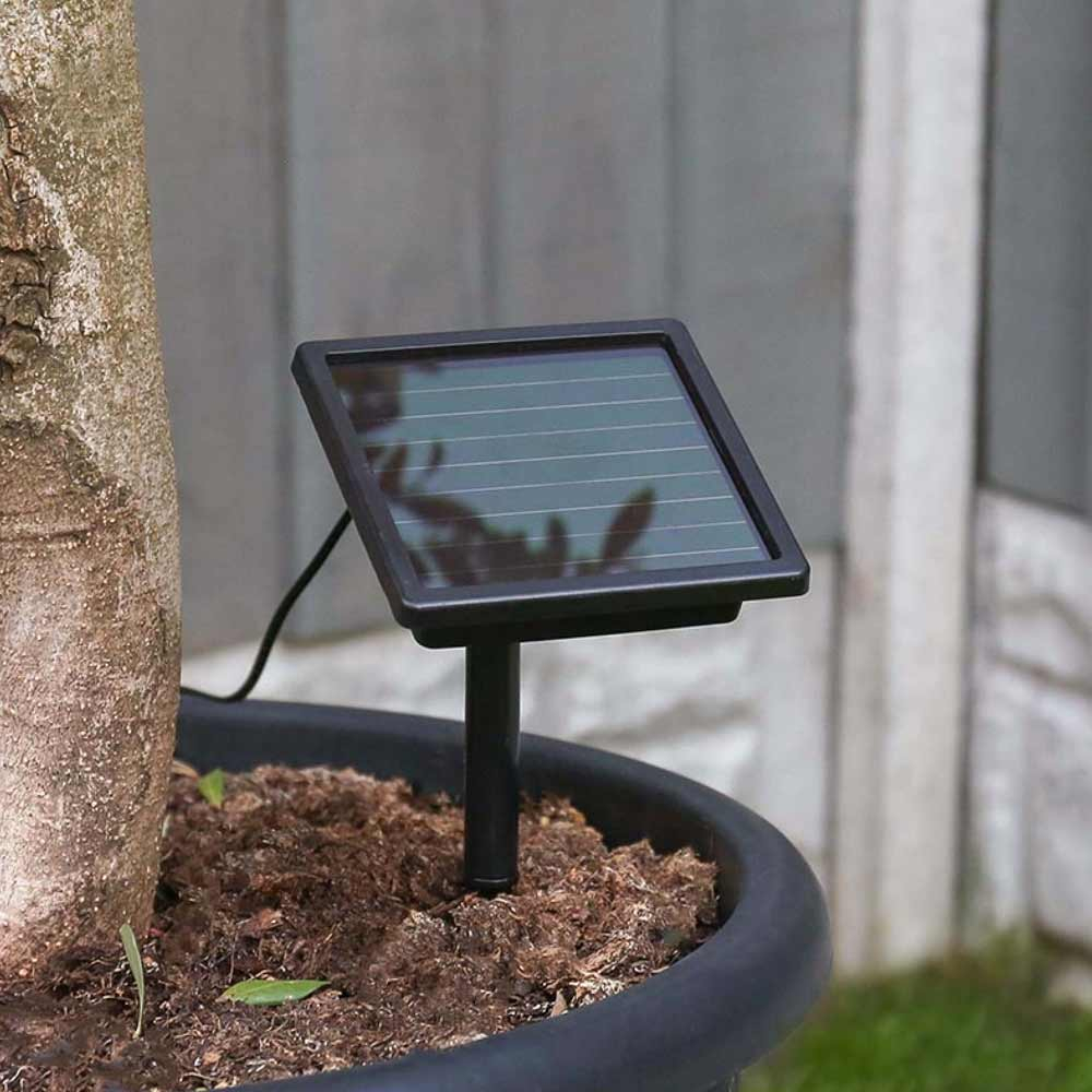 Solar Fairy lights Connectable showing panel in ground using spike