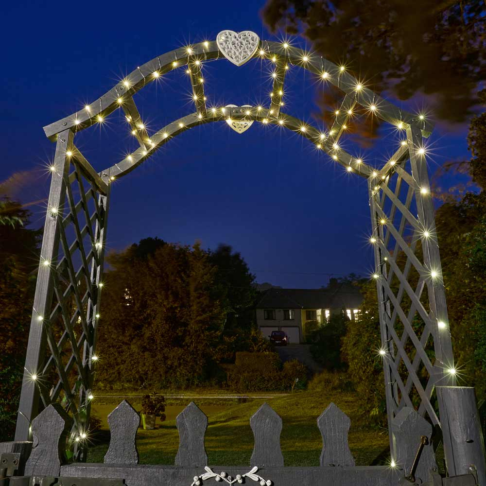 Solar Firefly Lights 200 Warm White on Arch in garden