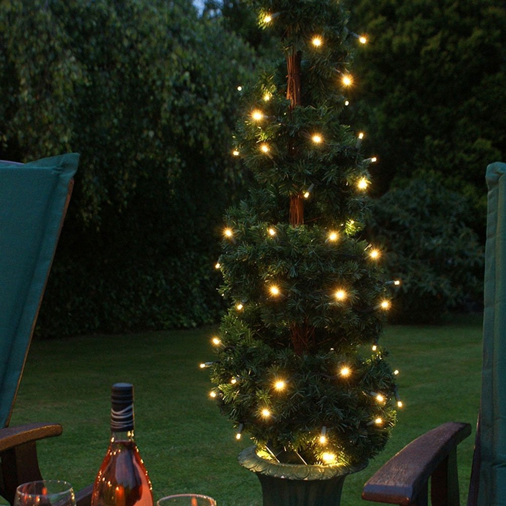 Solar Firefly String Lights 50 Warm White in garden on tree