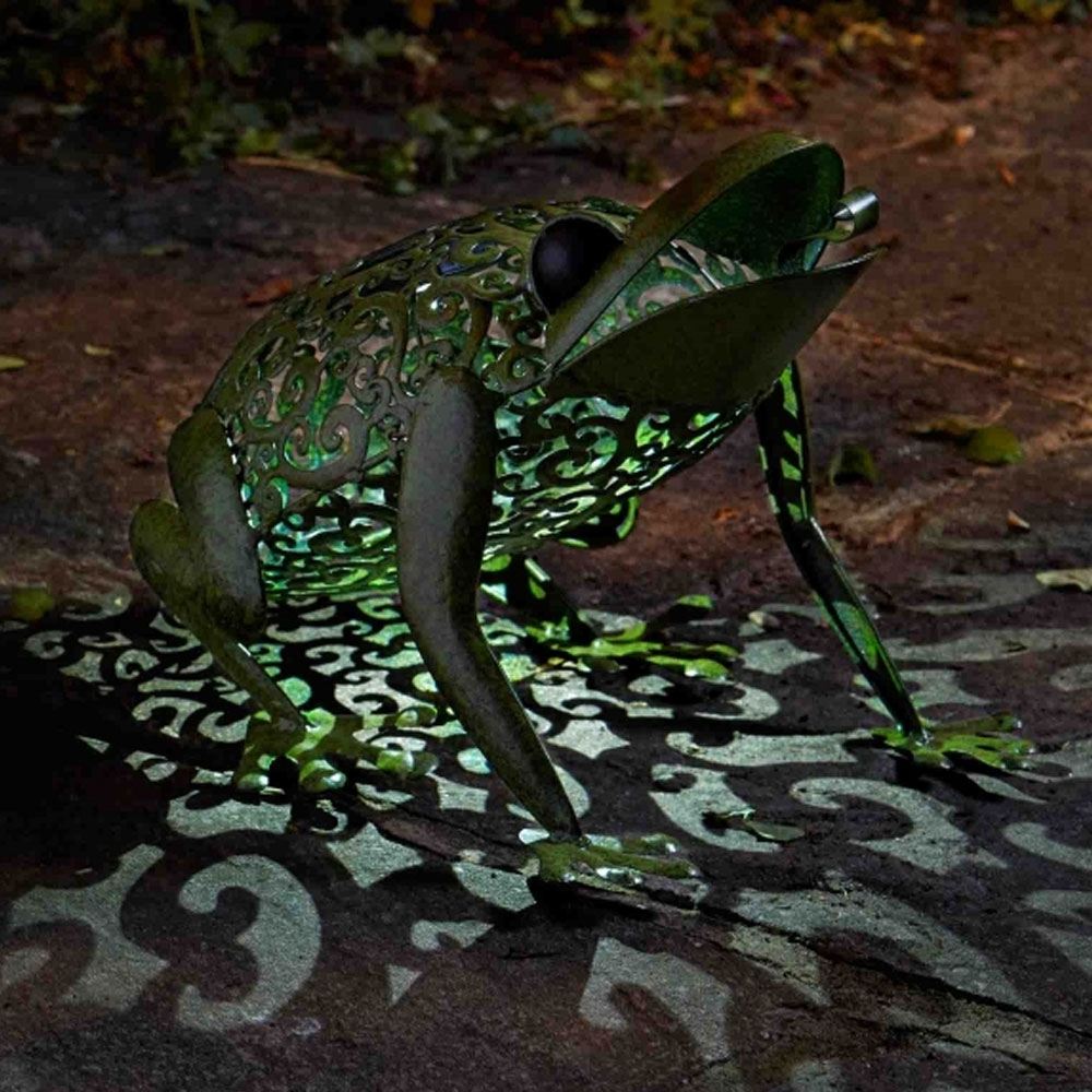 Solar Frog Silhouette Light on patio in garden at night