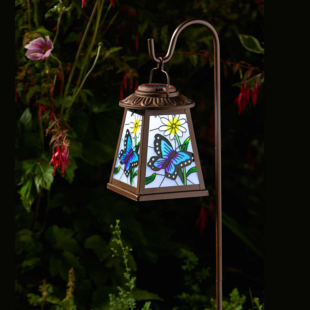 Solar Powered Butterfly Lantern in garden at night
