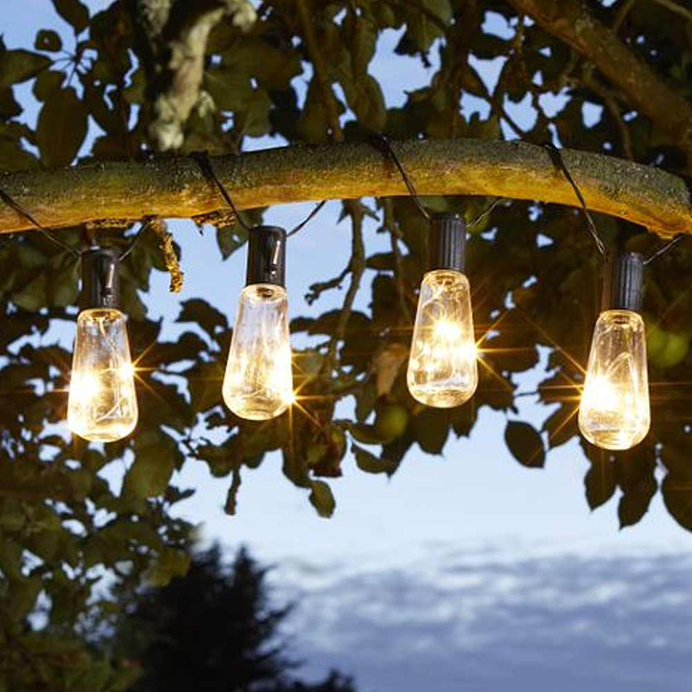 Solar Powered Festoon Lights Vintage Bulbs turned on in tree