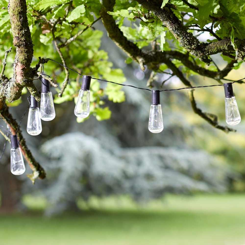 Solar Powered Festoon Lights Vintage Bulbs in daytime in tree