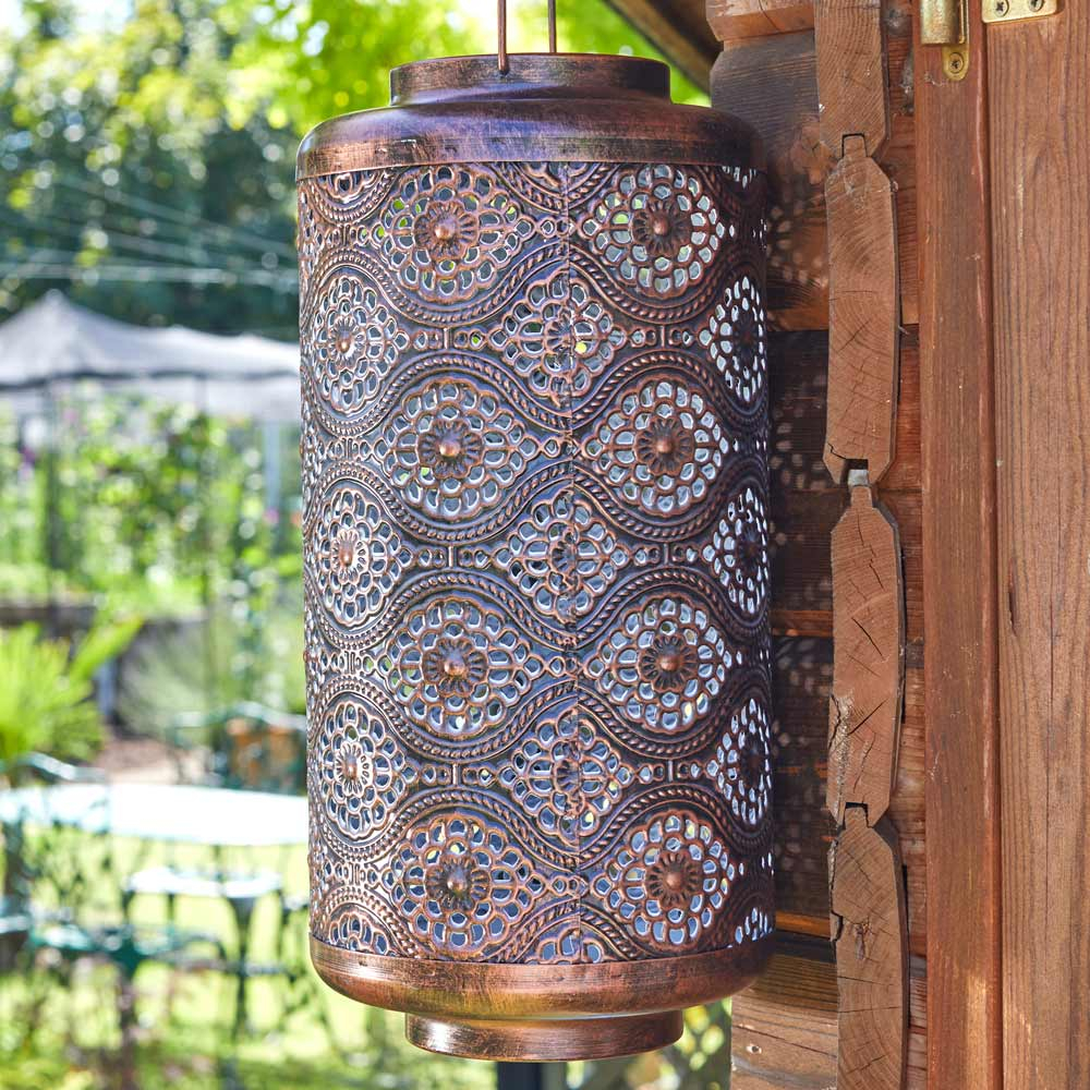 Solar Powered Fez Lantern hanging in garden on shed close up