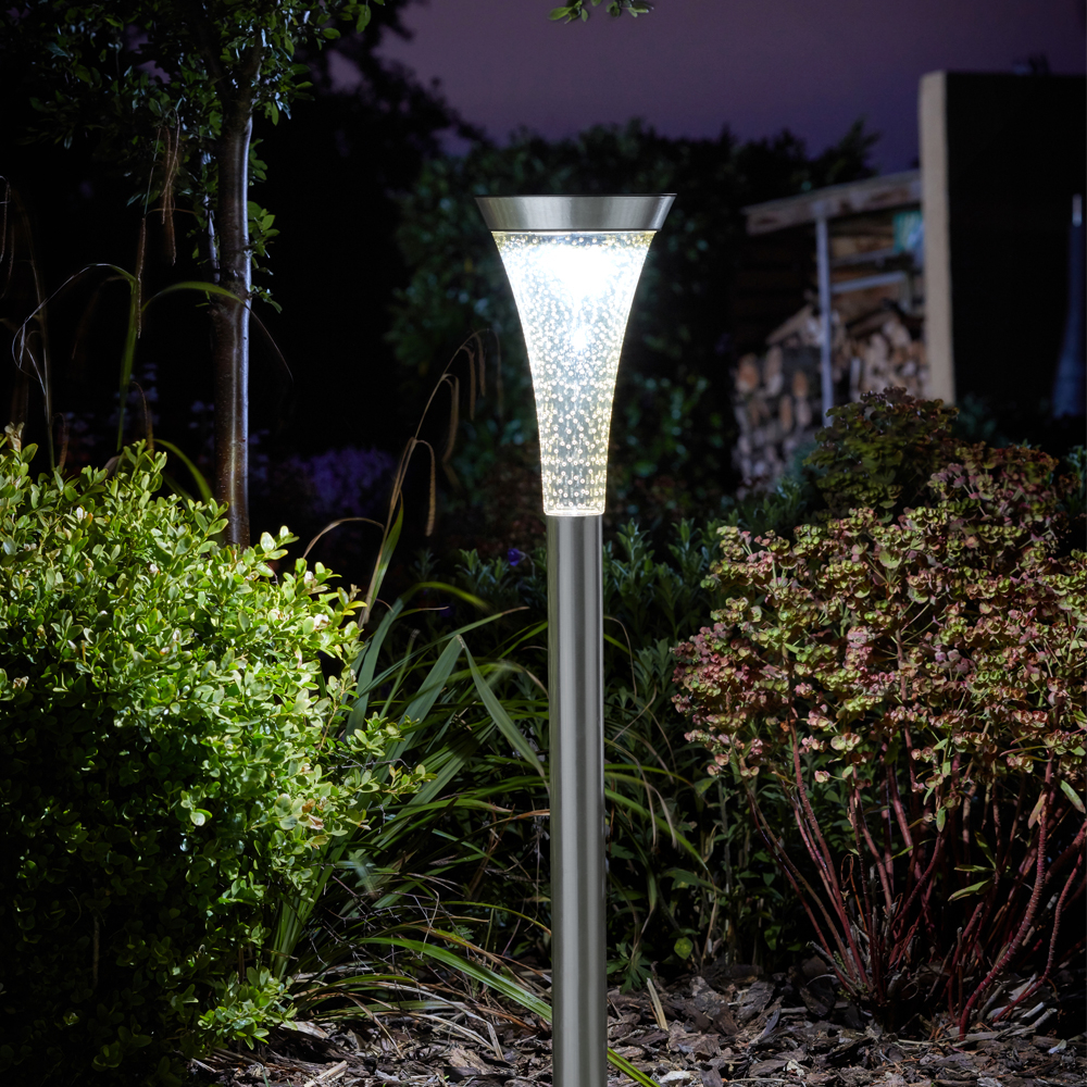 Solar Powered Sirius Stake Light in garden at night time