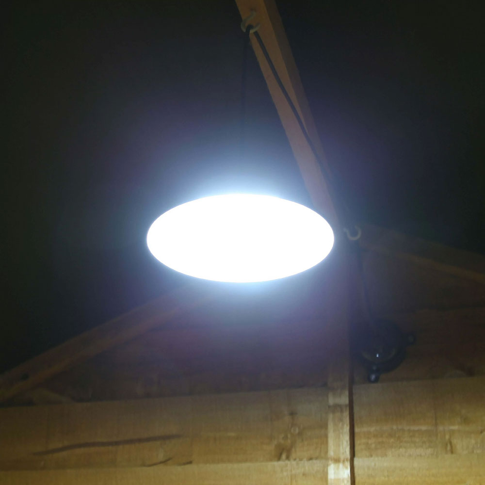 Solar Powered Shed Light with Pull Cord turned on inside shed