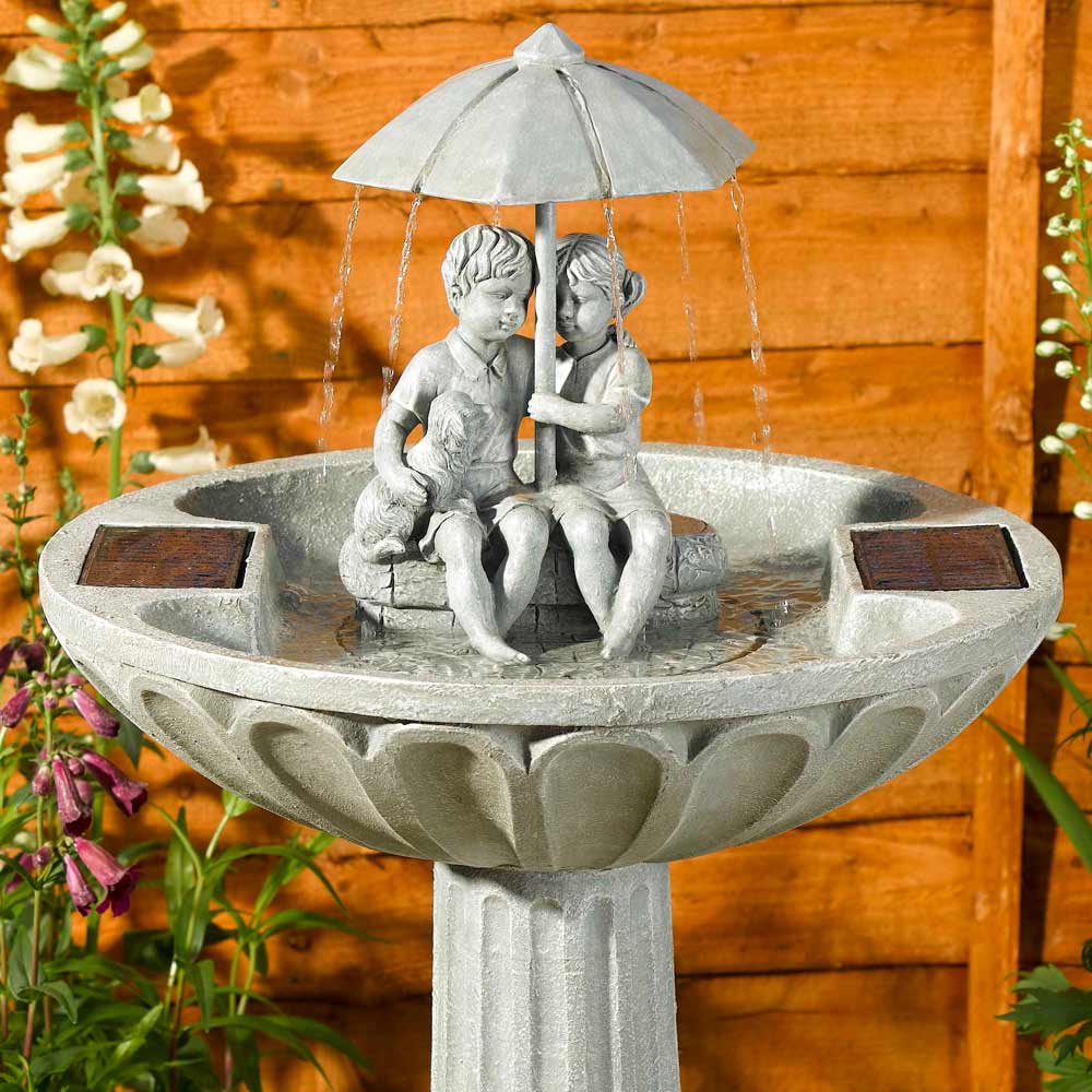 Solar Umbrella Fountain Water Feature close up of boy & girl