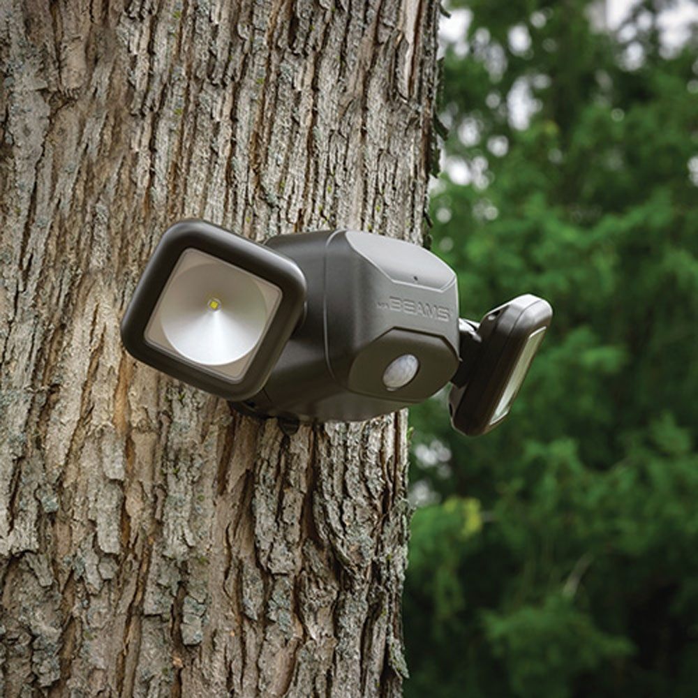 Twin Head Battery Security Light mounted on tree