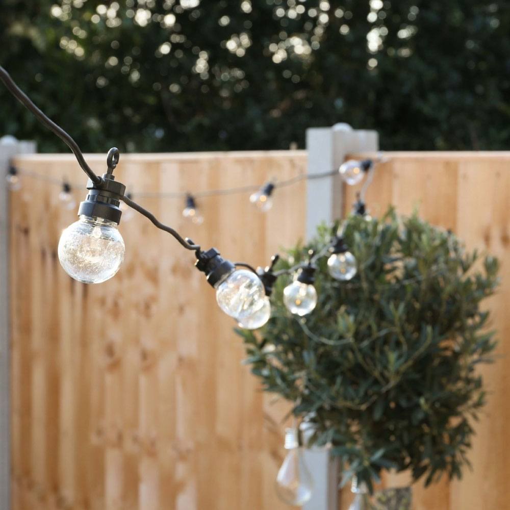 Outdoor Festoon Lights Clear Bulbs Black Cable in garden turned off