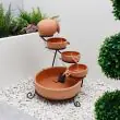 Terracotta Cascade Solar Water Feature - four-tier terracotta bowls on black metal stand shown against white background