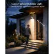 Rechargeable motion sensor light beside a front door at dusk