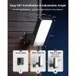 Rechargeable motion sensor light beside a front door at dusk