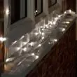 Connect Pro Outdoor Lights Dual Colour White Cable in garden on fence