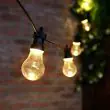 Connectable Battery Festoon Lights Large Traditional Bulbs on fence turned on