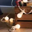 Festoon Lights Connectable Frosted Bulb White Cable in trees
