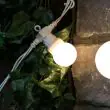 Festoon Lights Connectable Frosted Bulb White Cable in trees