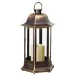 Nordic Candle Lanterns in garden flower bed