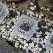 2 White Solar Garden Glass Brick Lights being used in various locations around the garden and driveway 