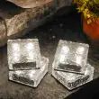 2 White Solar Garden Glass Brick Lights being used in various locations around the garden and driveway 