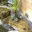 Solar Frog Spitter Showing Water Pump